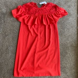 Red dress with lace detail.